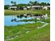 Community features a lake with palm trees and houses reflecting in the water at 2025 St George Dr, Davenport, FL 33837