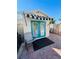 Private guest house with teal doors and striped awning at 2025 St George Dr, Davenport, FL 33837