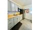 Updated kitchen featuring gray cabinets, wood countertops, and stainless steel appliances at 2025 St George Dr, Davenport, FL 33837