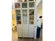 Well-organized pantry with glass-front cabinets offering ample storage at 2025 St George Dr, Davenport, FL 33837