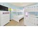 Bedroom with twin-over-twin bunk beds and a dresser, offering space for multiple guests at 2468 Dubai St, Kissimmee, FL 34747