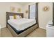 Guest bedroom with queen-size bed and stylish decor at 2468 Dubai St, Kissimmee, FL 34747