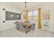 Elegant dining room with wood table and gray velvet chairs at 2468 Dubai St, Kissimmee, FL 34747