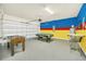 Game room with a pool table, foosball table, and ample space for entertainment at 2468 Dubai St, Kissimmee, FL 34747