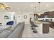 Modern kitchen with dark cabinets, granite countertops, and stainless steel appliances at 2468 Dubai St, Kissimmee, FL 34747