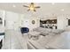 Open concept living area with gray sectional sofa and kitchen at 2468 Dubai St, Kissimmee, FL 34747