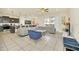 Open concept living area with gray sectional sofa and large TV at 2468 Dubai St, Kissimmee, FL 34747