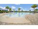 Resort-style pool with lounge chairs and palm trees at 2468 Dubai St, Kissimmee, FL 34747