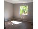 Bright bedroom with wood-look flooring and a large window at 2850 N Powers Dr # 9, Orlando, FL 32818