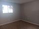 Spacious bedroom with wood-look flooring and a window at 2850 N Powers Dr # 9, Orlando, FL 32818