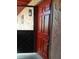 Condo entryway with a red door, providing a warm welcome into the unit at 2850 N Powers Dr # 9, Orlando, FL 32818