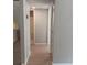 Hallway with mirrored closet doors and light flooring throughout at 2850 N Powers Dr # 9, Orlando, FL 32818