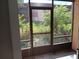 Private screened patio overlooking a lush green space at 2850 N Powers Dr # 9, Orlando, FL 32818