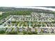 Aerial view of a residential neighborhood with a variety of houses at 3258 Spicer Ave, Grand Island, FL 32735