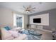 Bright living room with white sectional sofa, large TV, and stylish decor at 4819 Memories Ln, Kissimmee, FL 34746