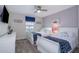 Bedroom with twin beds, white dresser, and blue accents at 4819 Memories Ln, Kissimmee, FL 34746