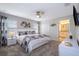 Main bedroom with king-size bed, ensuite bathroom, and modern decor at 4819 Memories Ln, Kissimmee, FL 34746