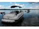 Rear view of a beige and blue bowrider boat on a lake at 616 Georgetown Dr # B, Casselberry, FL 32707