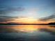 Stunning sunset over a calm lake with colorful sky reflection at 616 Georgetown Dr # B, Casselberry, FL 32707