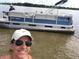 Personal smiling in front of a blue pontoon boat named Livin' the Dream at 616 Georgetown Dr # B, Casselberry, FL 32707