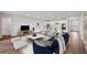 Spacious living room with hardwood floors and kitchen views at 15065 Willow Ridge Dr, Montverde, FL 34756