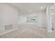 Spacious loft area with carpeted floors and plenty of natural light at 15065 Willow Ridge Dr, Montverde, FL 34756