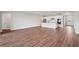 Open living area with hardwood floors and views to the kitchen at 15065 Willow Ridge Dr, Montverde, FL 34756