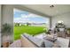 Extended patio with seating area and view of the backyard at 15065 Willow Ridge Dr, Montverde, FL 34756
