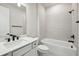 Clean bathroom with white vanity, bathtub and modern fixtures at 15065 Willow Ridge Dr, Montverde, FL 34756