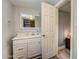 Clean bathroom with a white vanity and updated fixtures at 213 Sandy Cir, South Daytona, FL 32119