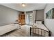 Bedroom with two twin beds and access to a patio at 213 Sandy Cir, South Daytona, FL 32119