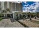 House exterior with a paved driveway and landscaping at 213 Sandy Cir, South Daytona, FL 32119