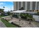 Charming house with palm trees, walkway, and a gravel front yard at 213 Sandy Cir, South Daytona, FL 32119
