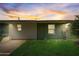 View of the house's exterior at dusk, showcasing the garage at 213 Sandy Cir, South Daytona, FL 32119