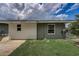 View of the house's exterior, showcasing a well-maintained lawn at 213 Sandy Cir, South Daytona, FL 32119