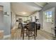 Open kitchen with island, stainless steel appliances, and light flooring at 213 Sandy Cir, South Daytona, FL 32119