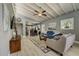 Open concept living room with hardwood floors and kitchen views at 213 Sandy Cir, South Daytona, FL 32119