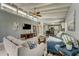 Open concept living room with hardwood floors and kitchen views at 213 Sandy Cir, South Daytona, FL 32119
