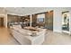 Open living room with a modern sectional and built-in entertainment center at 2550 Venetian Way, Winter Park, FL 32789