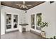 Outdoor kitchen with stainless steel appliances and seating area at 2550 Venetian Way, Winter Park, FL 32789