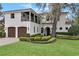 Beautiful two-story home with a lush green lawn at 2550 Venetian Way, Winter Park, FL 32789