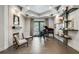 Music room features a grand piano, floating shelves, and a modern fireplace at 2550 Venetian Way, Winter Park, FL 32789