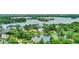 Aerial view of lakefront community with lush landscaping at 2550 Venetian Way, Winter Park, FL 32789