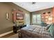 Teenage bedroom with TV and built-in shelving at 2550 Venetian Way, Winter Park, FL 32789