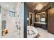 Spa-like bathroom with a large walk-in shower and a soaking tub at 2550 Venetian Way, Winter Park, FL 32789