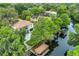 Aerial view of waterfront property with private dock at 2550 Venetian Way, Winter Park, FL 32789