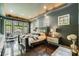 Spacious main bedroom with a large bed, dark wood floors, and plenty of natural light at 2550 Venetian Way, Winter Park, FL 32789
