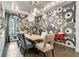 Modern dining room featuring a large floral wall mural and a wood table at 2550 Venetian Way, Winter Park, FL 32789
