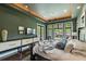 Main bedroom with a king-size bed and access to a private balcony at 2550 Venetian Way, Winter Park, FL 32789