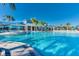 Large community pool with lounge chairs and palm trees at 3829 Lana Ave, Davenport, FL 33897